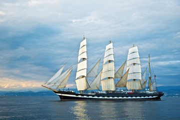Obraz na płótnie Canvas Tall ship race in the Black sea. Large white sails on masts. Beauty seascape.