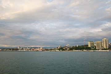 Fototapeta premium Seaside of the Sochi city. High buildings on the coast. Beauty sky clouds. 