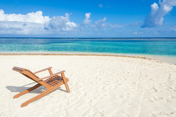 Relaxing on chair - South Water Caye - Small tropical island at Barrier Reef with paradise beach - known for diving, snorkeling and relaxing vacations - Caribbean Sea, Belize, Central America