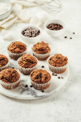 Delicious homemade muffins on a marble board. Baking and cooking concept.