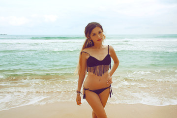 Fototapeta na wymiar portrait young caucasian woman in swimsuit on the beach, Brazil