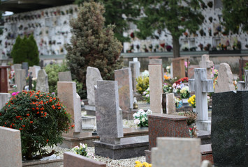 inside a cemetery with many tombs and tombstones