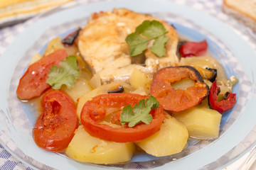 Fototapeta na wymiar fish with potatoes and tomato