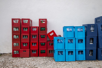 drink crates near a white wall