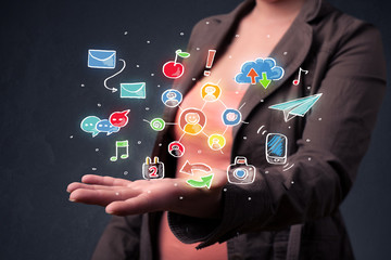 Smart woman holding colorful applications