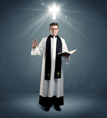 young priest in giving his blessing