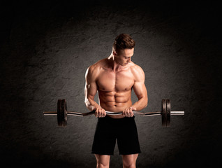 Sexy weight lifter guy showing muscles