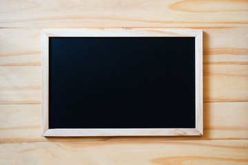 Blank  blackboard on wood background with copy space for your text. 