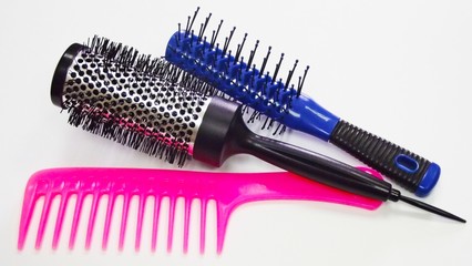 Hairdressing tools on white background.