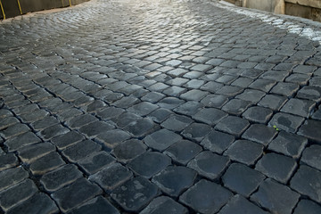 A texture of an old wet pavement