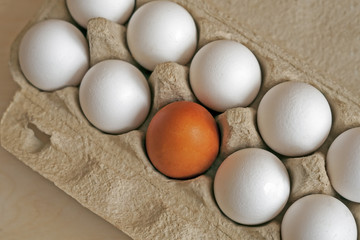 colored eggs in a cardboard box