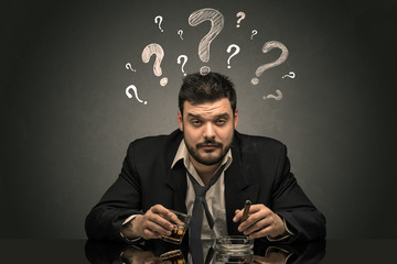 Drunk disappointed man with question signs concept