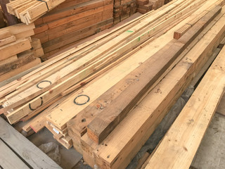 row stack of wood in storage warehouse