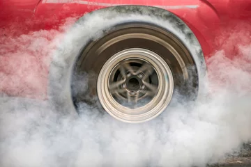 Fotobehang Drag racing car burns rubber off its tires in preparation for the race © toa555