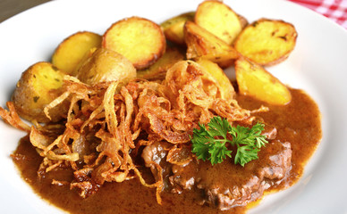 onion-topped roast beef with gravy is the favorite dish in Austria. (German name is Zwiebelrostbraten)