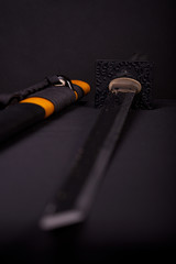 Katana over black background, horizontal image