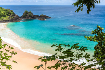 Fernando de Noronha, Brazil. Aerial view of Sancho Beach on Fernando de Noronha Island. View without anyone on the beach. Trees and plants around.