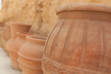 Fototapeta na wymiar many large clay pots standing in a row