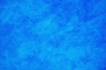 Fototapeta na wymiar Blue mottled grainy background