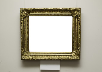 Golden vintage frame on wall