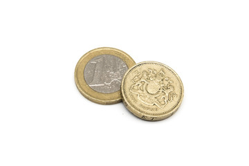 One Euro and Old One Pound Coins isolated on white background