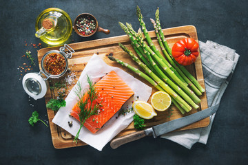 Fresh salmon fillet with aromatic herbs, spices and vegetables