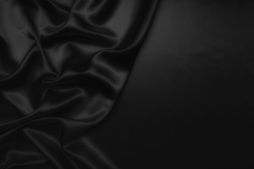 black abstract background luxury cloth or liquid wave or wavy folds of grunge silk texture satin velvet material or luxurious Christmas background or elegant wallpaper design, background