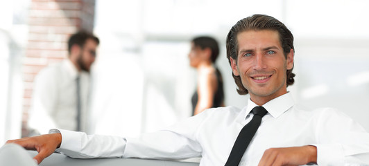 portrait of pensive businessman on blurred background.