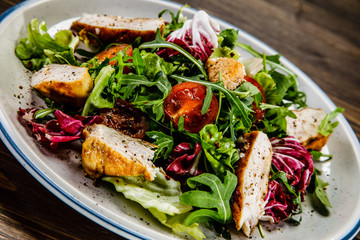 Caesar salad on wooden table 