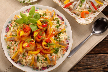 Rolled herrings with fish salad and lemon