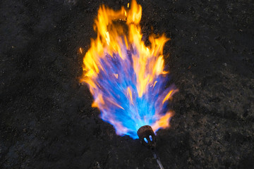 workers work with a gas burner