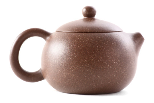 Little Chinese brown clay teapot for tea ceremony isolated on white background