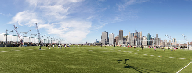 Soccer / Football pitch in Brooklyn with view on Manhattan in New York City.