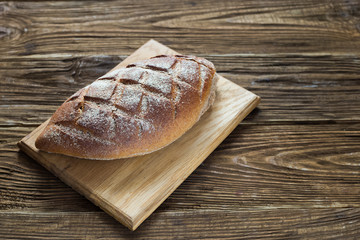 Healthy bread on wooden background. Natural light.