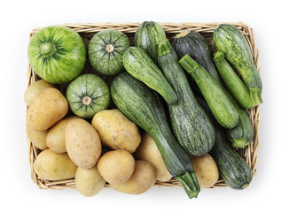 basket of zucchini, and potatoes food top view isolated on white background