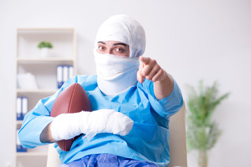 Fototapeta na wymiar Injured american football player recovering in hospital