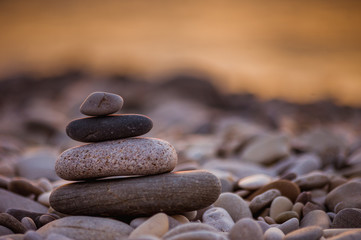 stack of zen stones on pebble beach