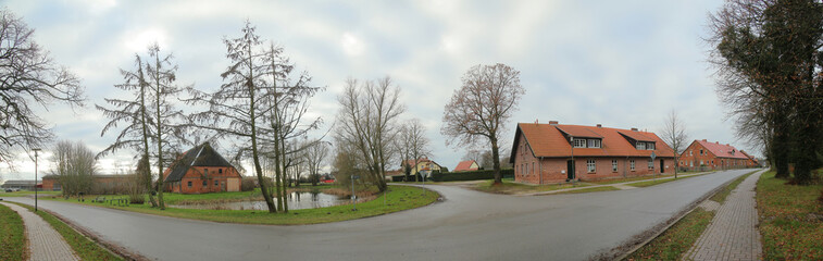 Parkstrasse in Griebenow, Germany. The historical buildings are part of the former palace grounds of the town