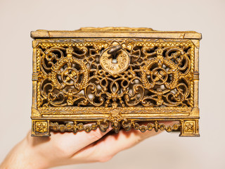hand holding an old box