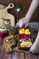 assorted pickled vegetables on wooden background