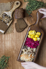 assorted pickled vegetables on wooden background
