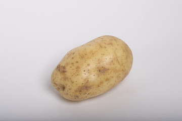 Raw potato isolated on white background.
