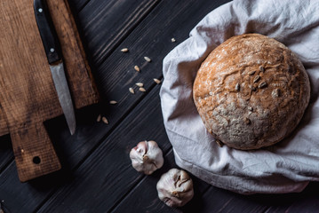 bread lies on a white cloth on a wooden table