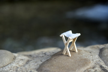 Symbol of fishing, go and fish, concept, float and a bucket for fish,fishing on the river or lake