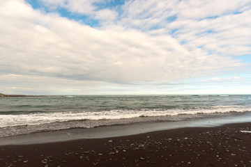Volcanic rock on black sand beach at Vik in southern Iceland