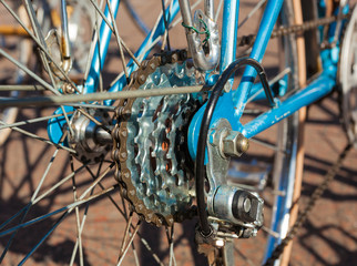 Fototapeta na wymiar Close-up of the Cassette of Sprockets of a blue Racing Bike, View from the Side