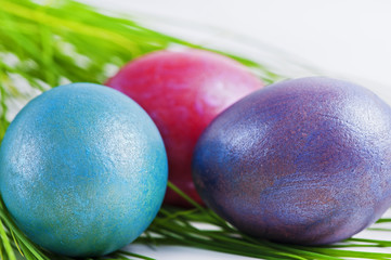 Three colorful Easter eggs on a white background
