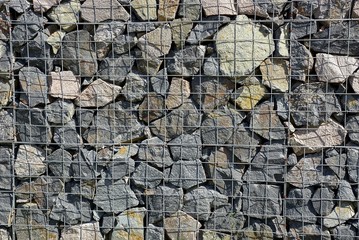 texture of the iron stack and stones in the wall
