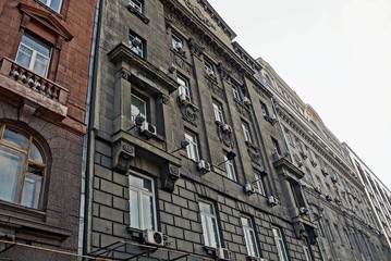 large gray and brown wall with windows