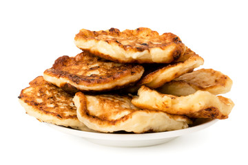 Bunch of homemade pancakes in a plate on white background